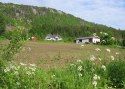 S�ndre Grini, gjenoppbygget etter brannen.Southern Grini farm, as it stands today, rebuilt after the fire.